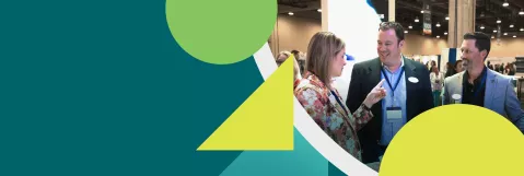 An image of an attendee speaking with an exhibitor in the exhibit hall