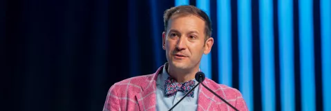 Craig Chepke speaking at a podium