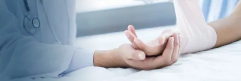 Healthcare provider wrapping a wound