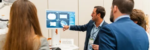 Attendees seeing new technology in exhibit hall