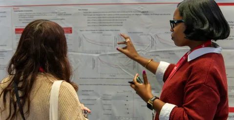 woman explaining her poster