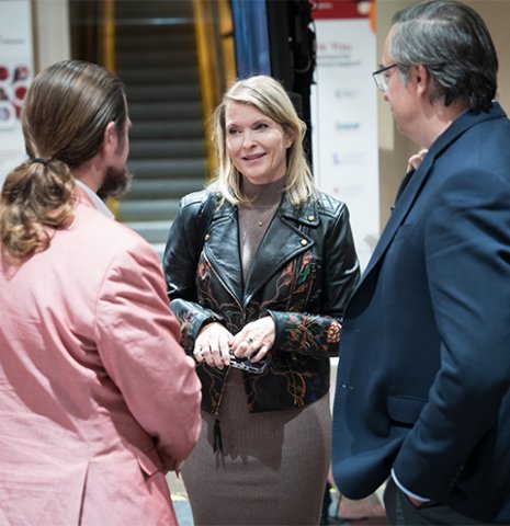 Attendees having a conversation at the exhibit hall at LL&M Congress