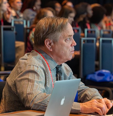 Attendee enjoying a session