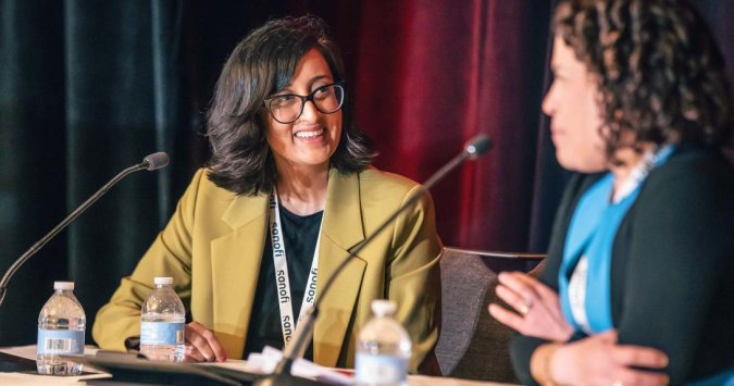 LL&M Great Debates - speakers talking to each other on stage