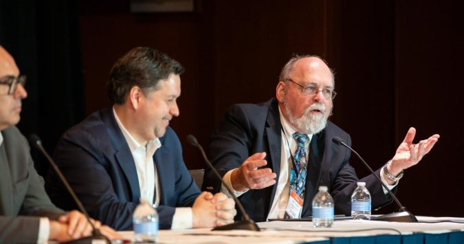 Oncology Learning Network Great Debates in Solid Tumors speakers on stage 